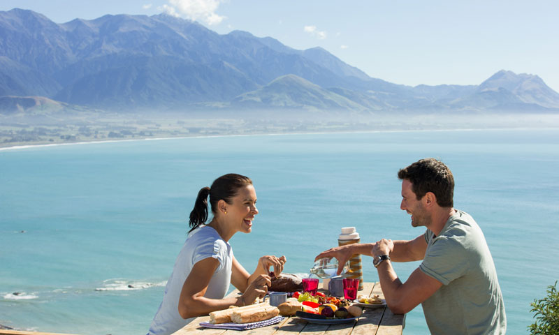 Couple sitting on bench sight seeing in Kaikoura
