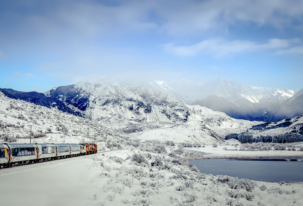 TranzAlpine train venturing into a stunning winter wonderland at Cass, New Zealand
